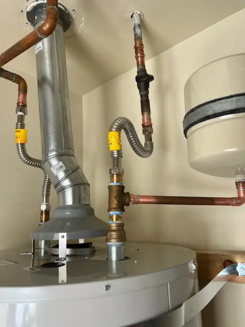 Water heater installation and plumbing repair in Ellis